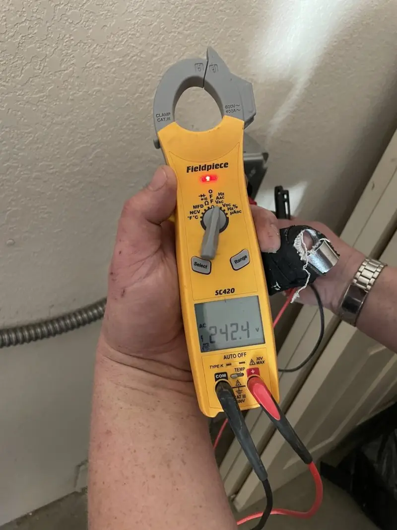 Voltage testing with clamp meter during Recessed Lighting Installation in Grand Island